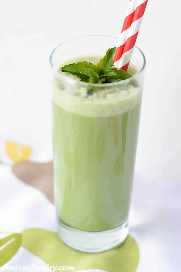 A glass of Matcha smoothie drink on a table
