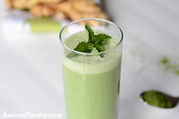 A glass of Matcha smoothie drink on a table