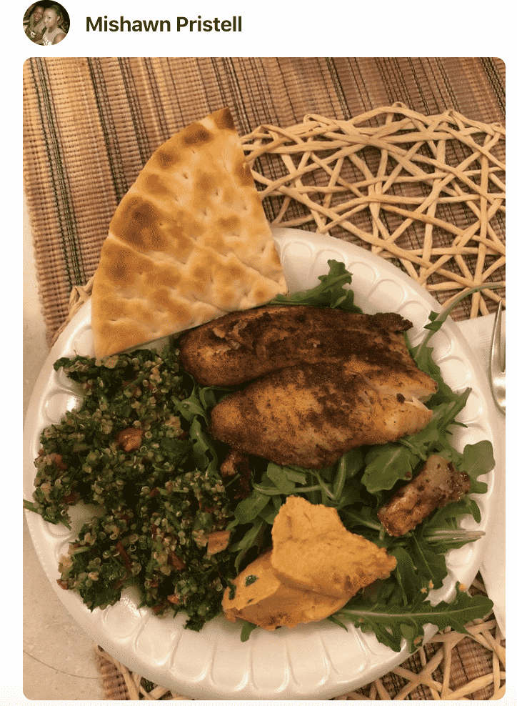 A plate of food with tabbouleh and bread
