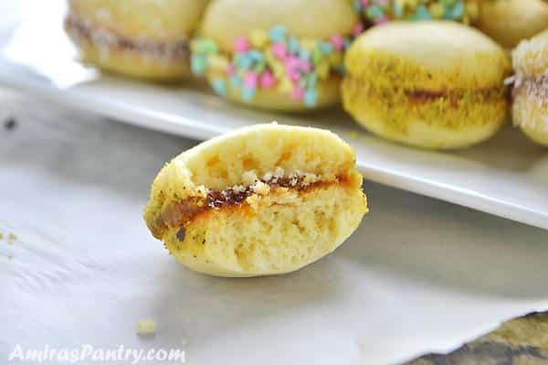 A close up of Lancashire cookies cut in half with jam