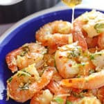 A close up of baked shrimp on a plate