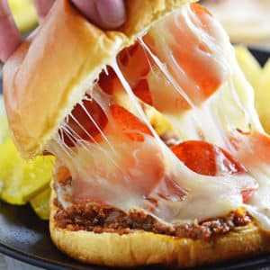 A close up of food, with Pizza burger and cheese
