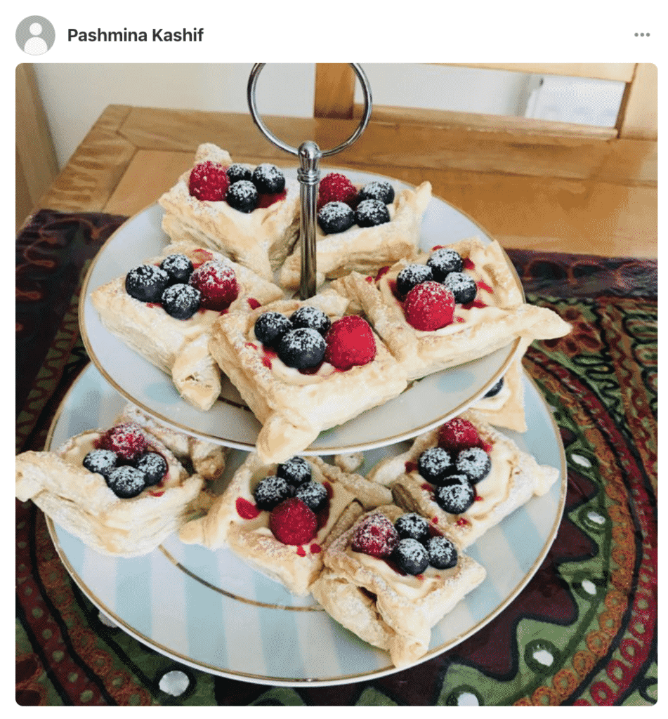 Plates with lemon raspberry tarts made by a fan