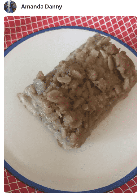 A piece of apple crisp bars on a plate, made by a fan