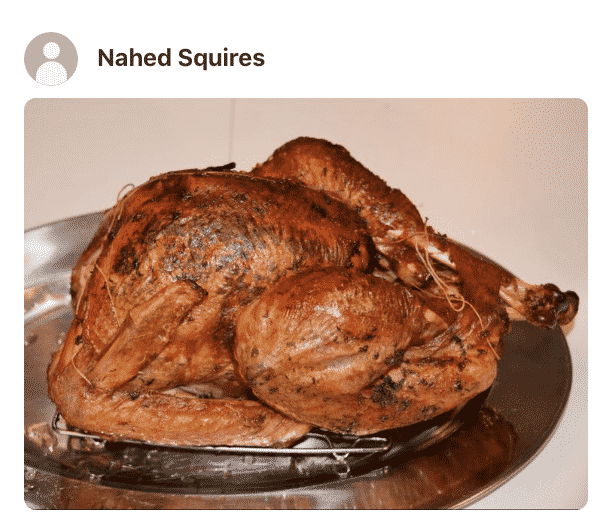 A close up of a roasted turkey made by a fan