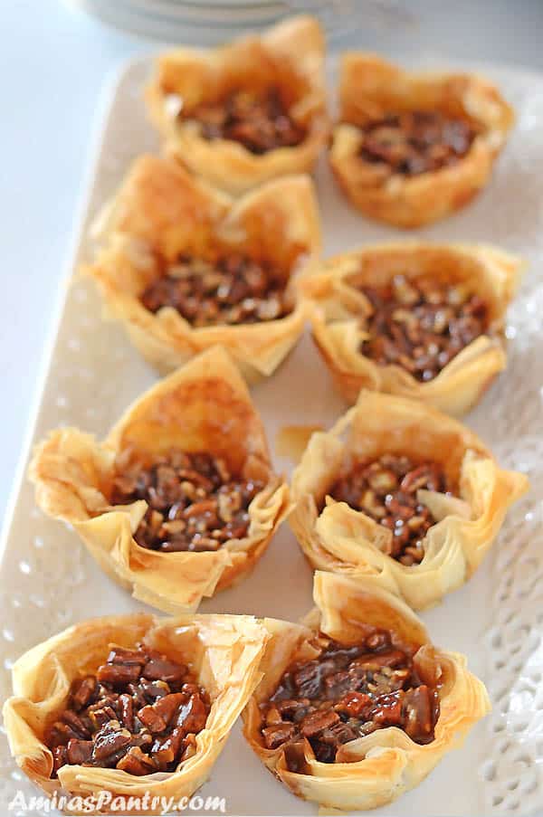 A plate with mini pecan pies