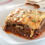 A close up of food on a plate, with Moussaka