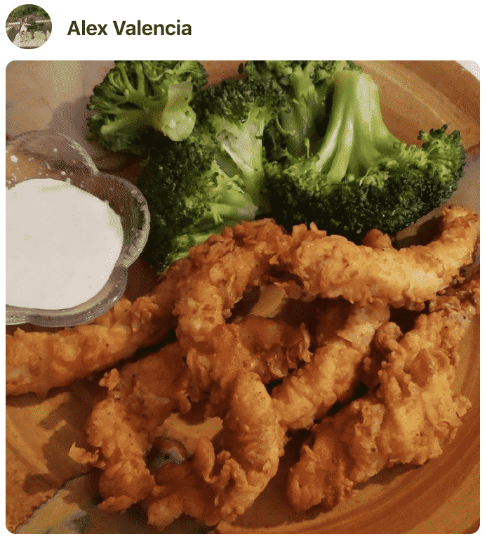 A plate of food with Chicken strips, made by a fan