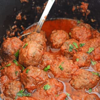 A close up of food in crockpot, with Meatballs