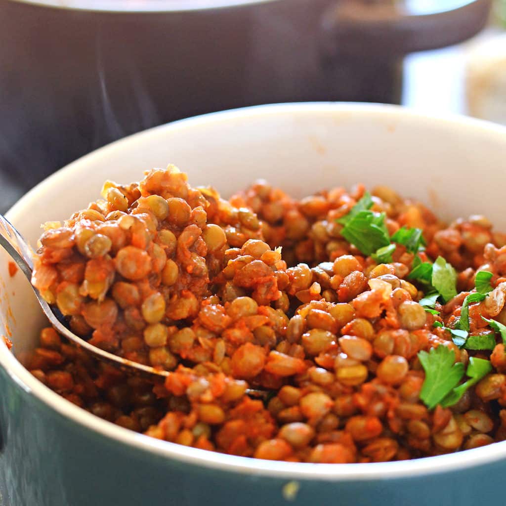 A bowl filled with lentil and vegetables