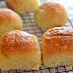 A close up of dinner rolls on a tray