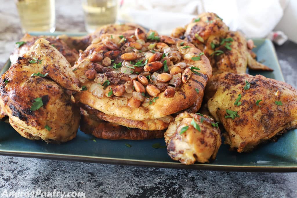 A plate of food with Musakhan, nuts and spices