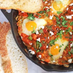 A close up of a part of Shakshouka in a Pan