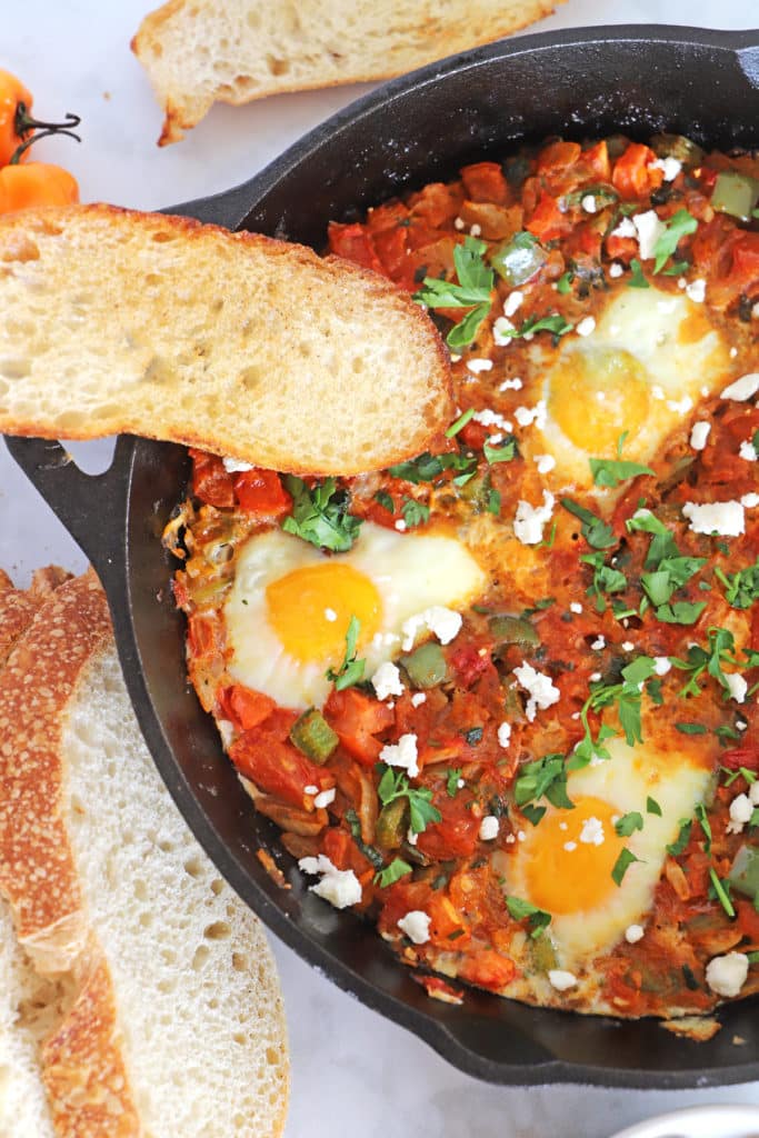 A close up of a part of Shakshouka in a Pan Meal Plan (71) - Amira's Pantry Meal Plan (71) &#8211; Amira&#8217;s Pantry shakshuka featured 683x1024
