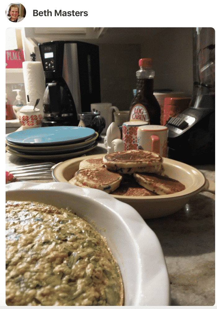 A plate of food on a counter, with Frittata and pancakes