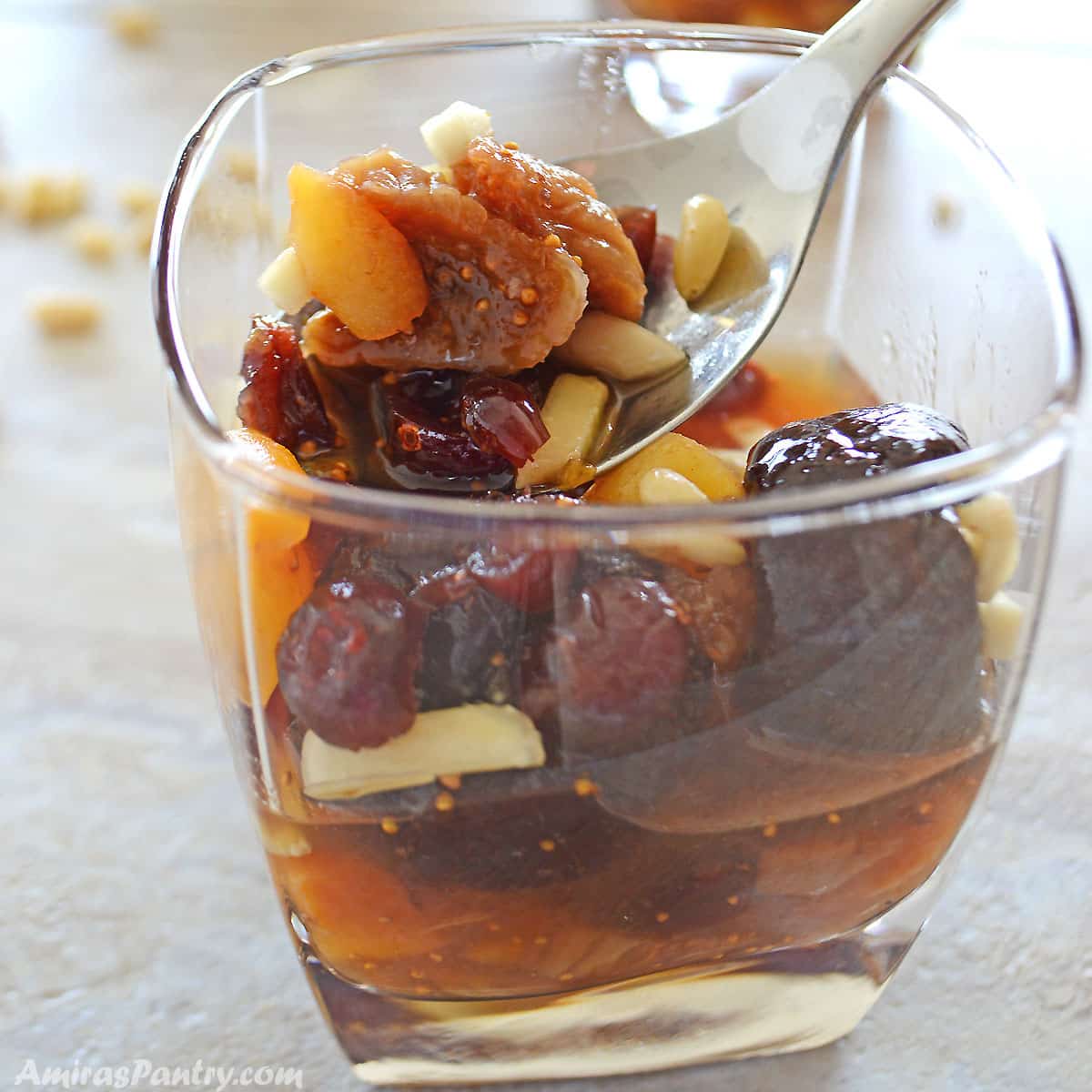 Dried figs, dried apricots and prunes in a mix with almonds in a