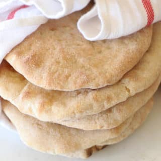 Several pita bread wrapped in a towel