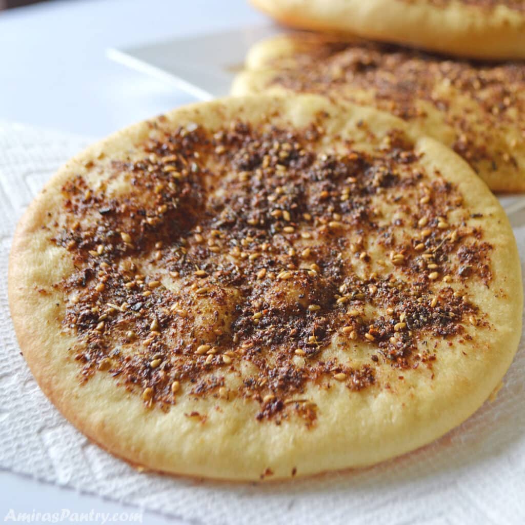 Manakeesh with za'atar made with the dough recipe and placed on a white kitchen towel