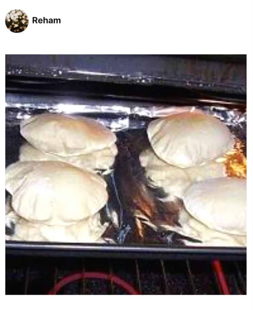 A photo showing Pita bread on a baking sheet made by a fan