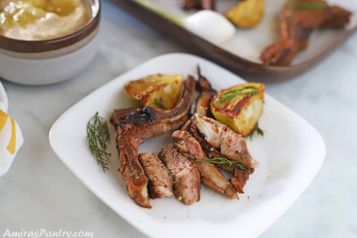 slices of lamb chops on a white plate with lemon wedges on the side. Marinated Lamb Chops (Classic Middle Eastern Marinade) Marinated Lamb Chops (Classic Middle Eastern Marinade) lamb chops recipe III