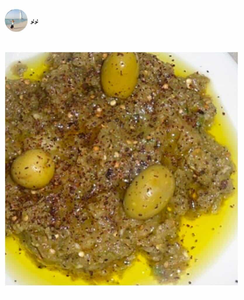 A plate of food, with Baba ghanoush, made by a fan