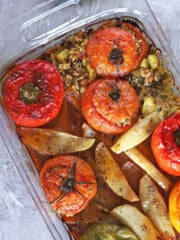 A bird's eye view of a Gemista casserole placed on a grey countertop.