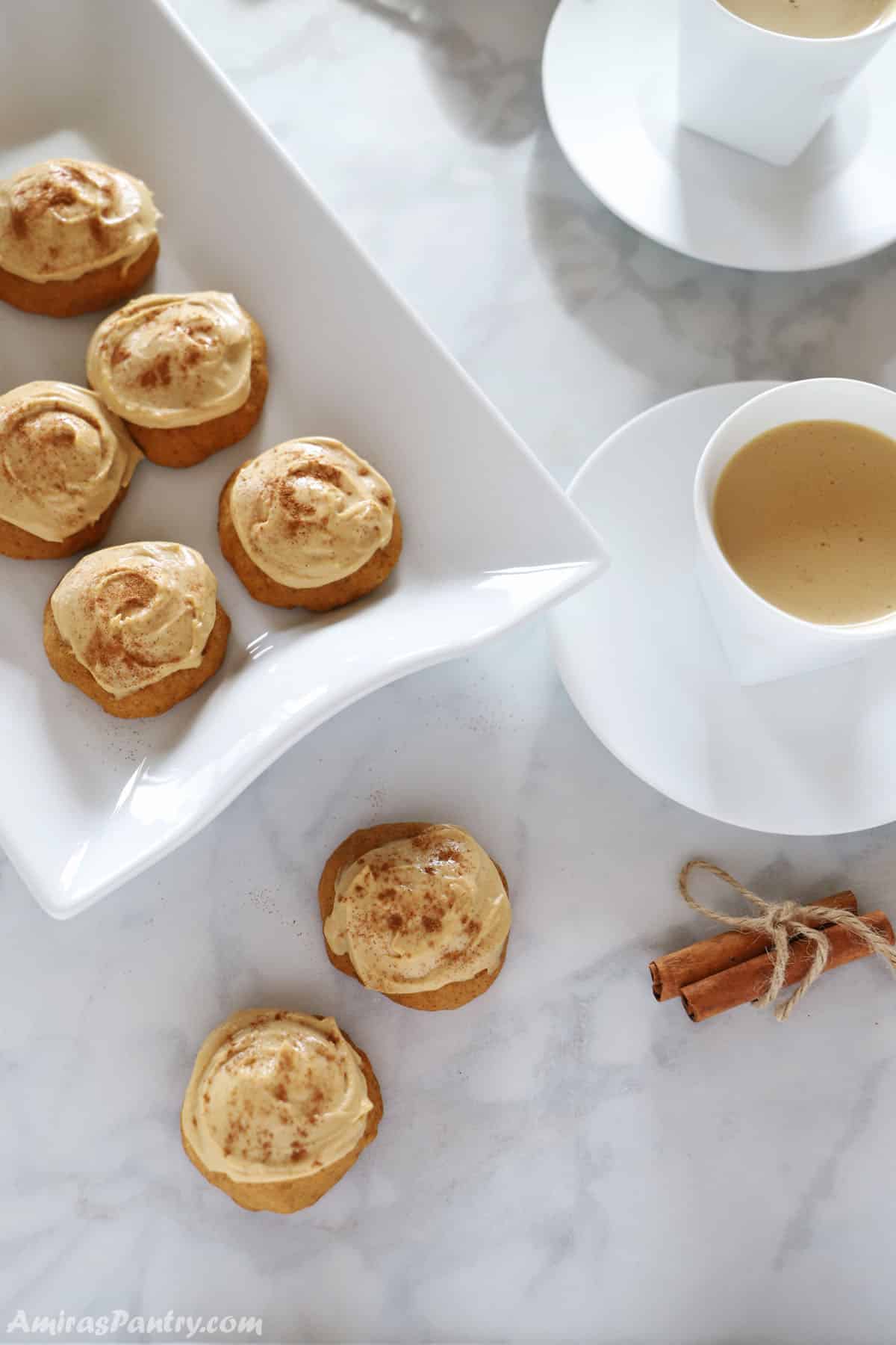 Sweet Potato cookies on a serving platter with cups of hot drinks on the side.