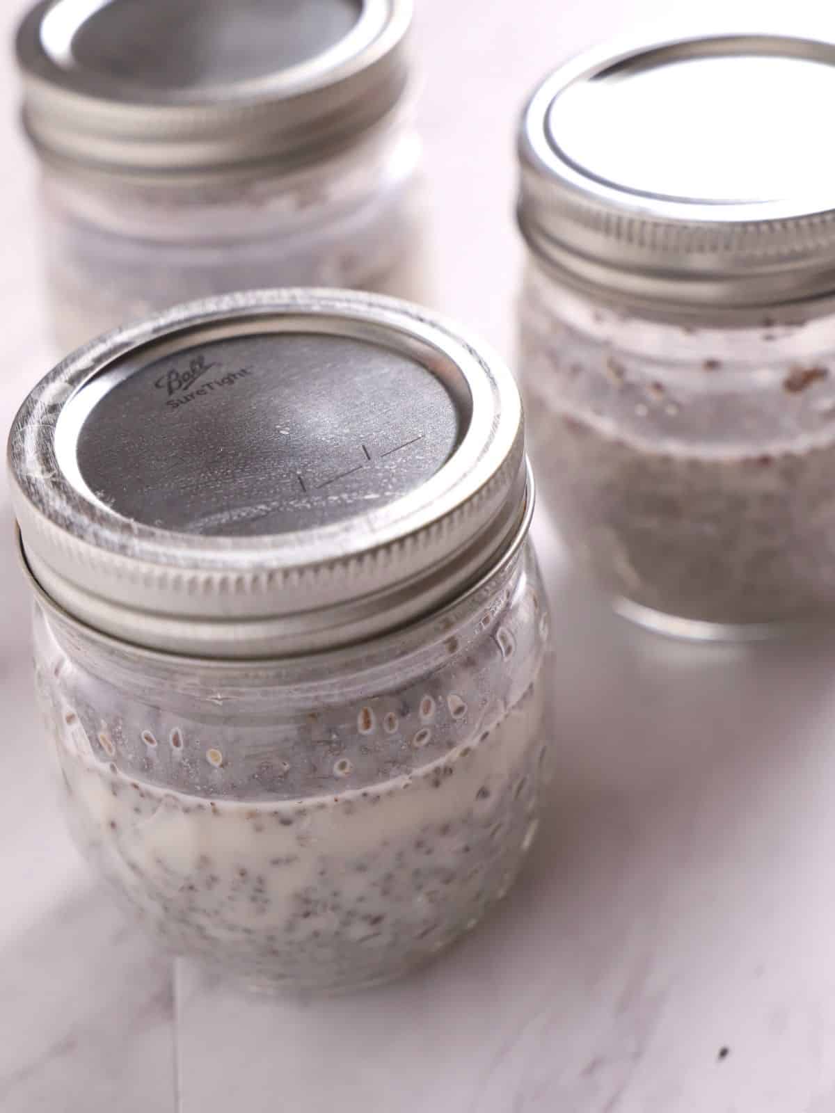 Chia pudding in Mason jars with lids on.