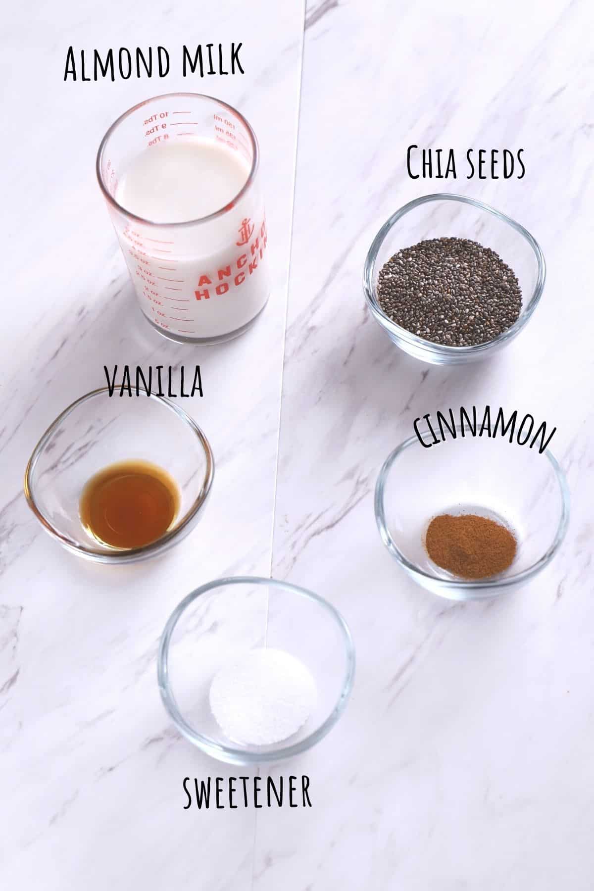 Chia pudding ingredients on a white surface.