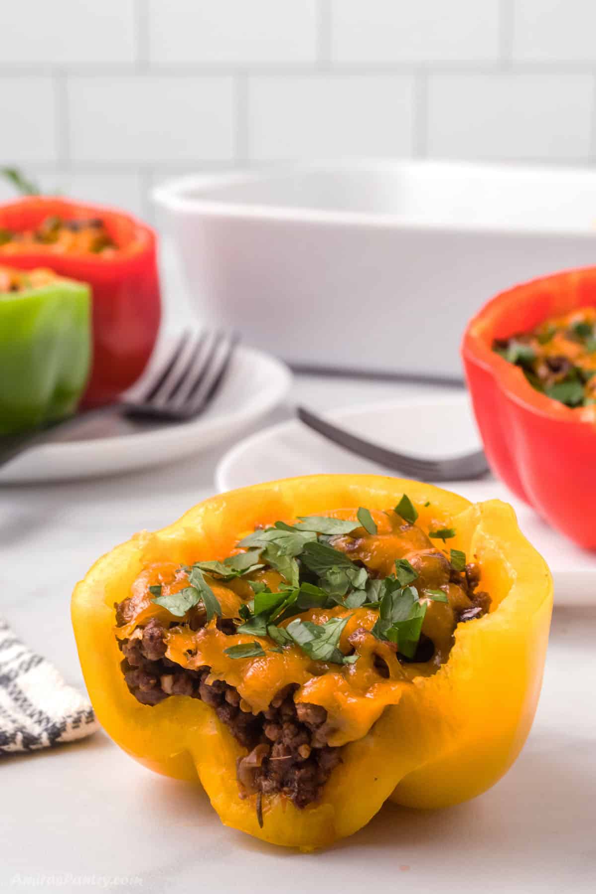 A close up look at a cut yellow pepper to show stuffing.