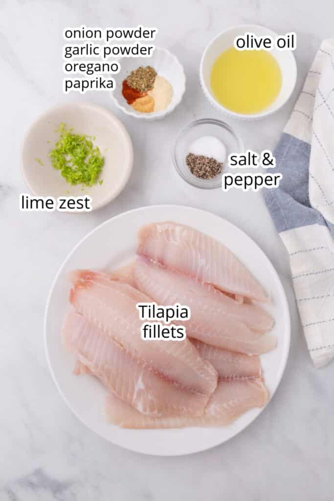 Air fryer tilapia recipe ingredients on a white surface.