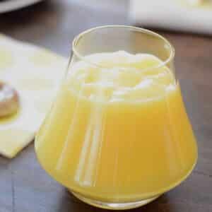 A glass cup filled with Lemon Curd.