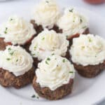 Meatloaf cupcakes on a white plate.