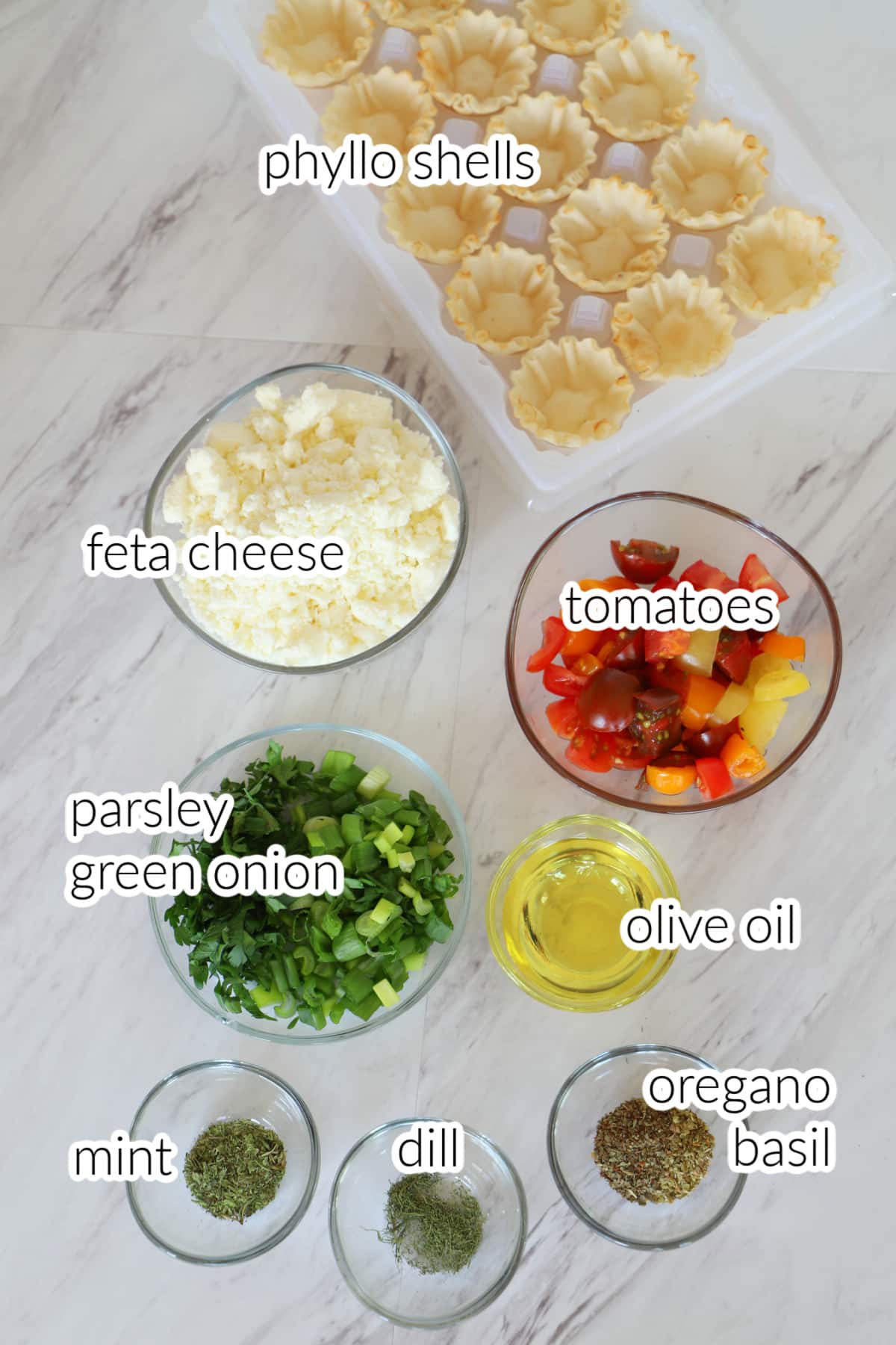 Recipe ingredients on a white table.