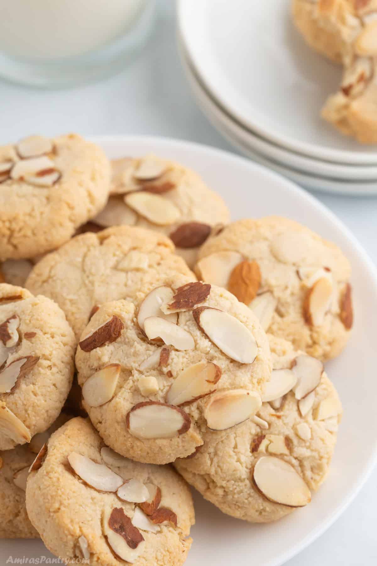 A white plate with almond cookies.