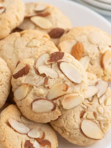 A white plate with almond cookies.