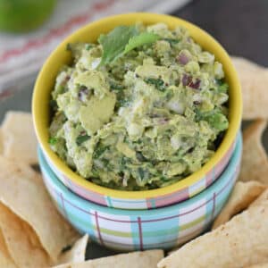 A yellow bowl with guacamole.