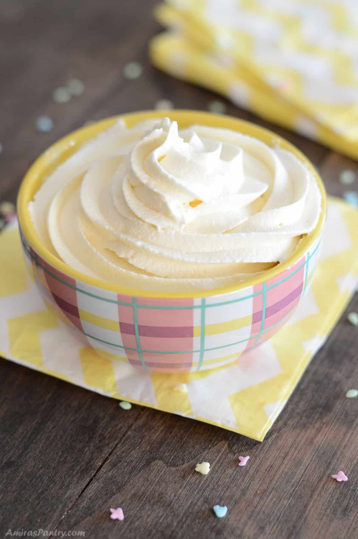 Marshmallow frosting in a pink bowl.