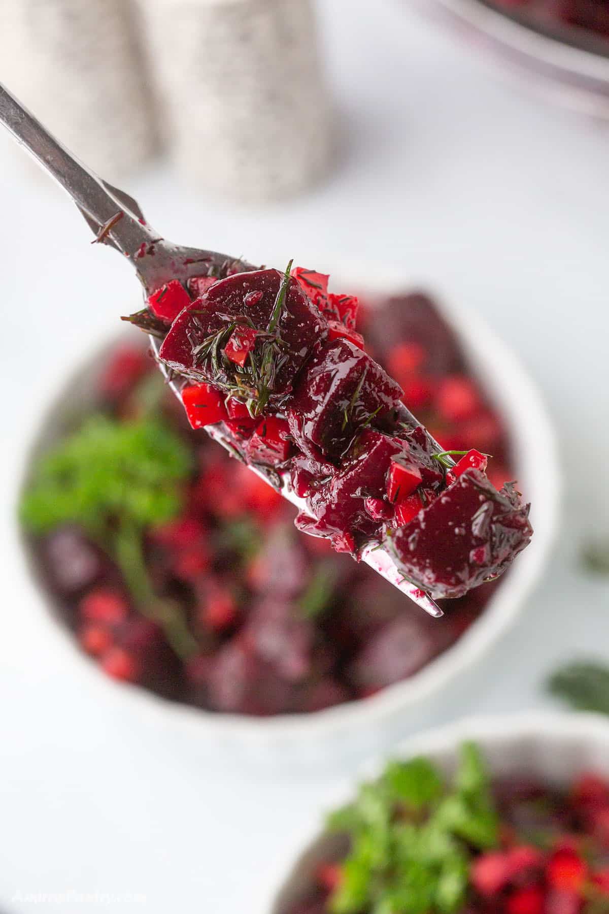 A fork with some beet salad.