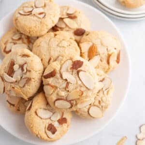 A white plate with almond cookies.