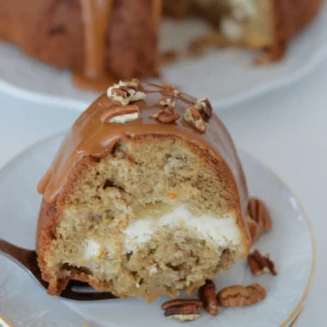 a close up look at a slice of apple bundt cake.