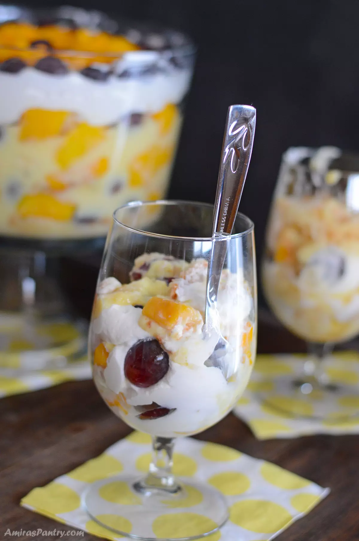 Fruit trifle in a tall wine glass.