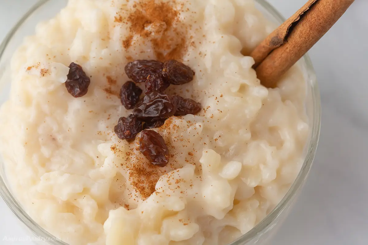 A zoomed in image on a plate with rice pudding.