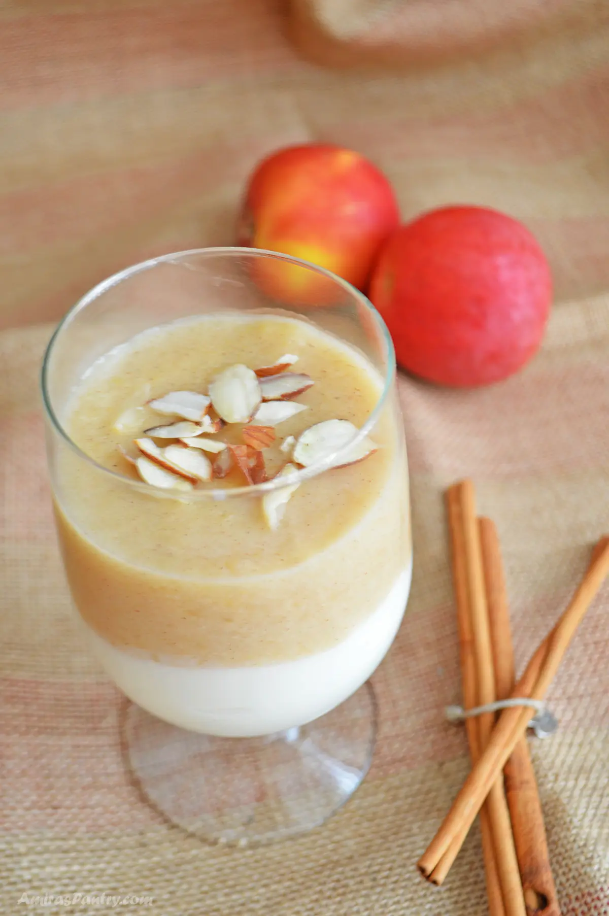 A cup with apple and milk pudding.
