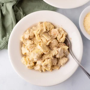A top view of chicken tortellini Alfredo on a white plate. Panera Chicken Tortellini Alfredo (Copycat Recipe) Panera Chicken Tortellini Alfredo (Copycat Recipe) panera chicken tortellini pasta card featured 300x300