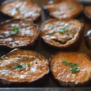 Eggplant slices on a roasting pan.