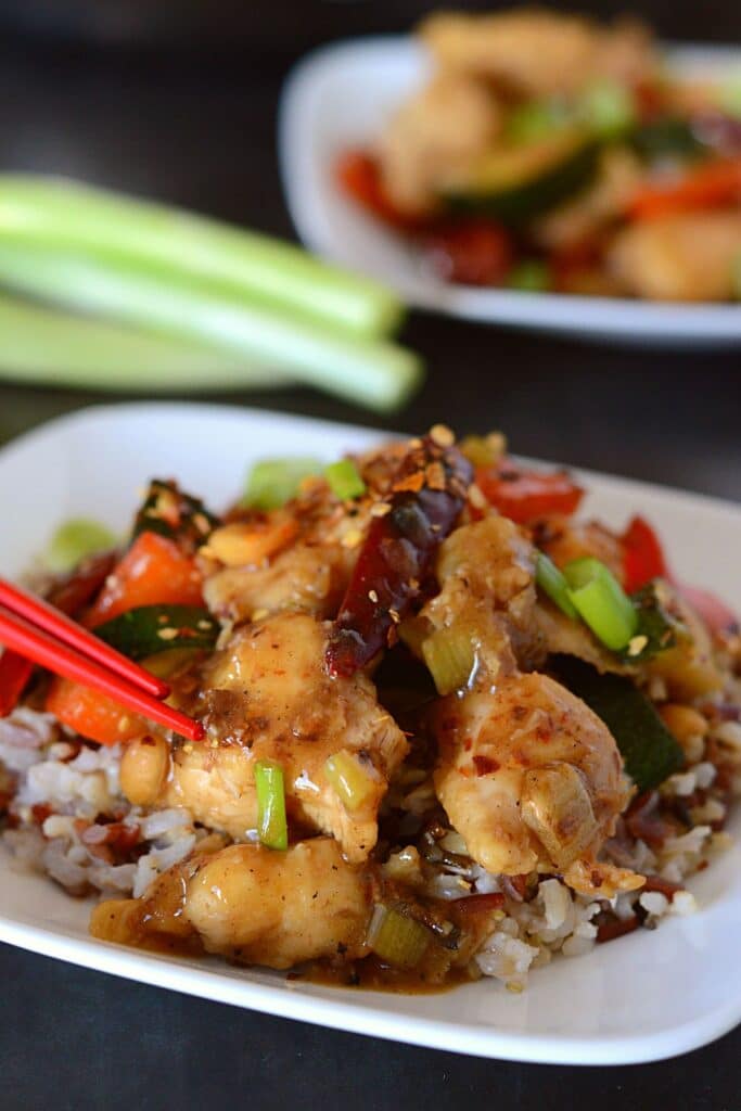 Kung Pao chicken on a white plate.