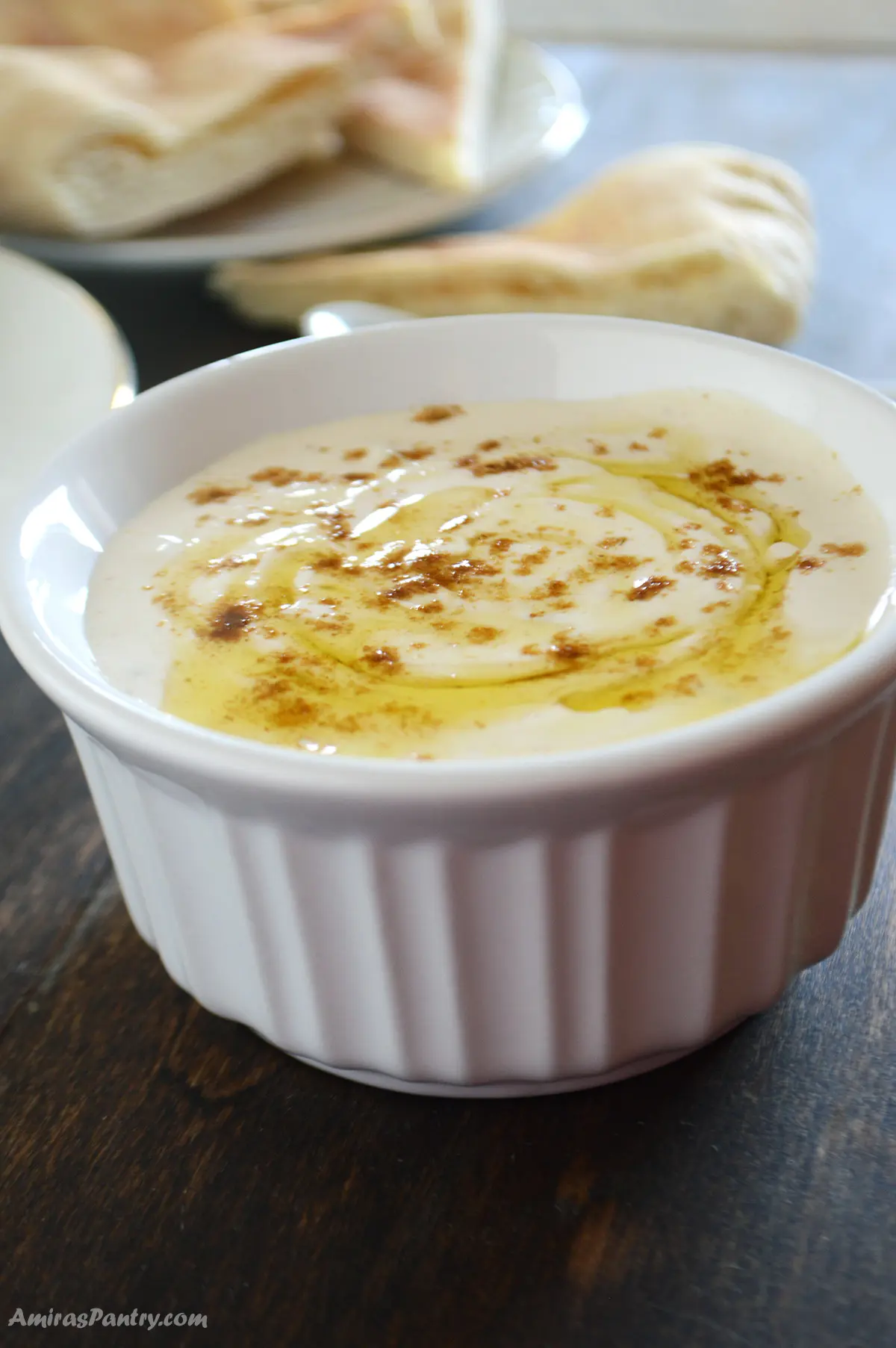 Tahini sauce in a small white bowl.