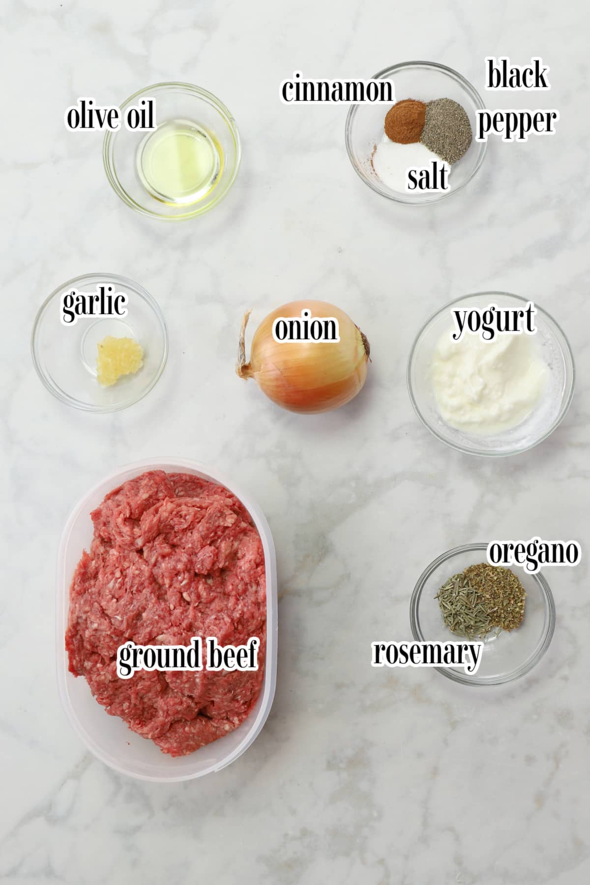gyros ingredients on a marble surface.