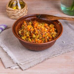 A brown bowl with Mirepoix.